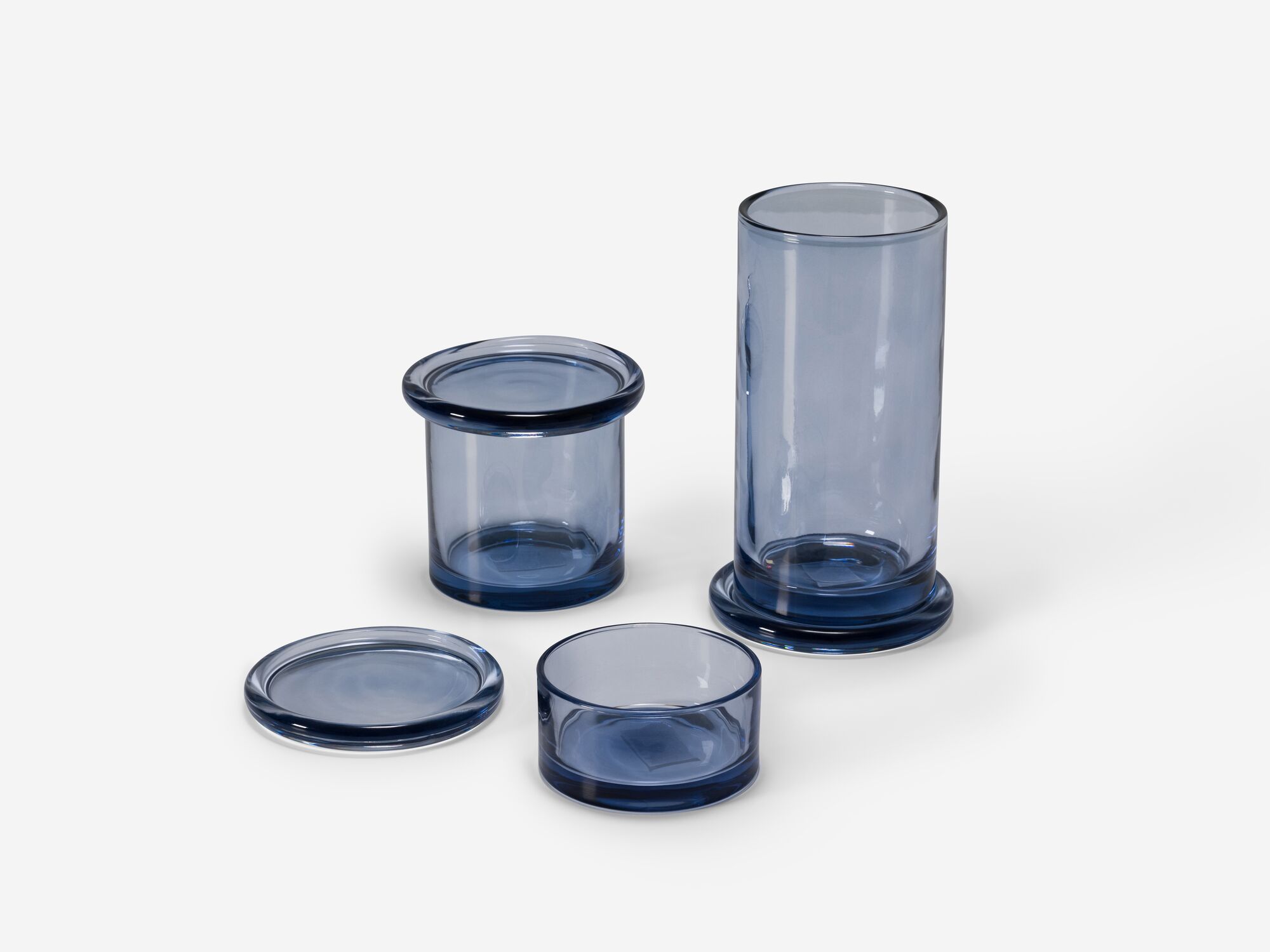 Front angle view of three glass organization containers with lids